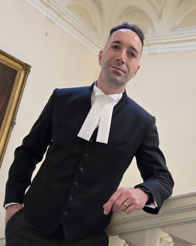 David Vallillee standing on staircase at Osgoode Hall Toronto Ontario